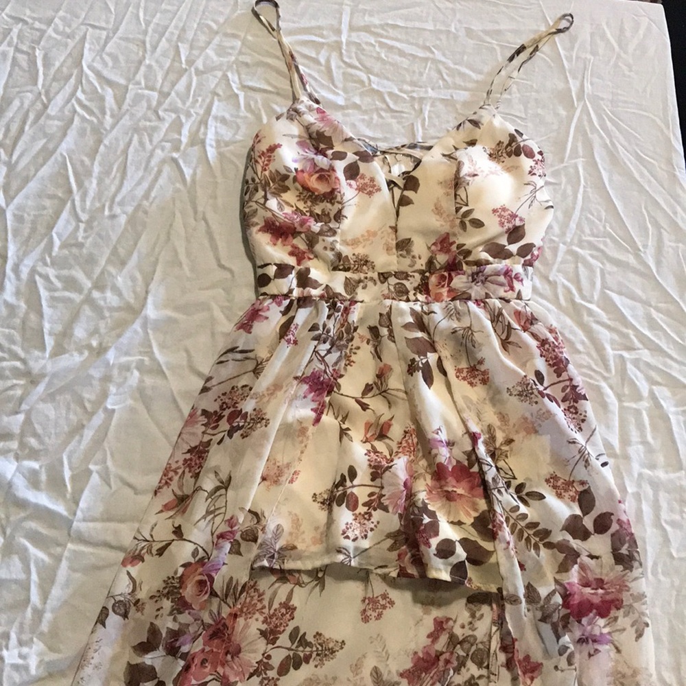 Flowing romper with flower patterns.
